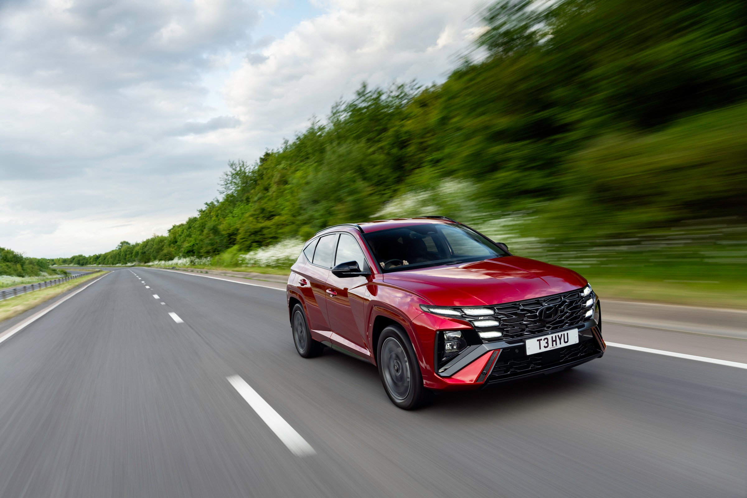 Hyundai Tucson Motability family SUV driving on a UK A-road