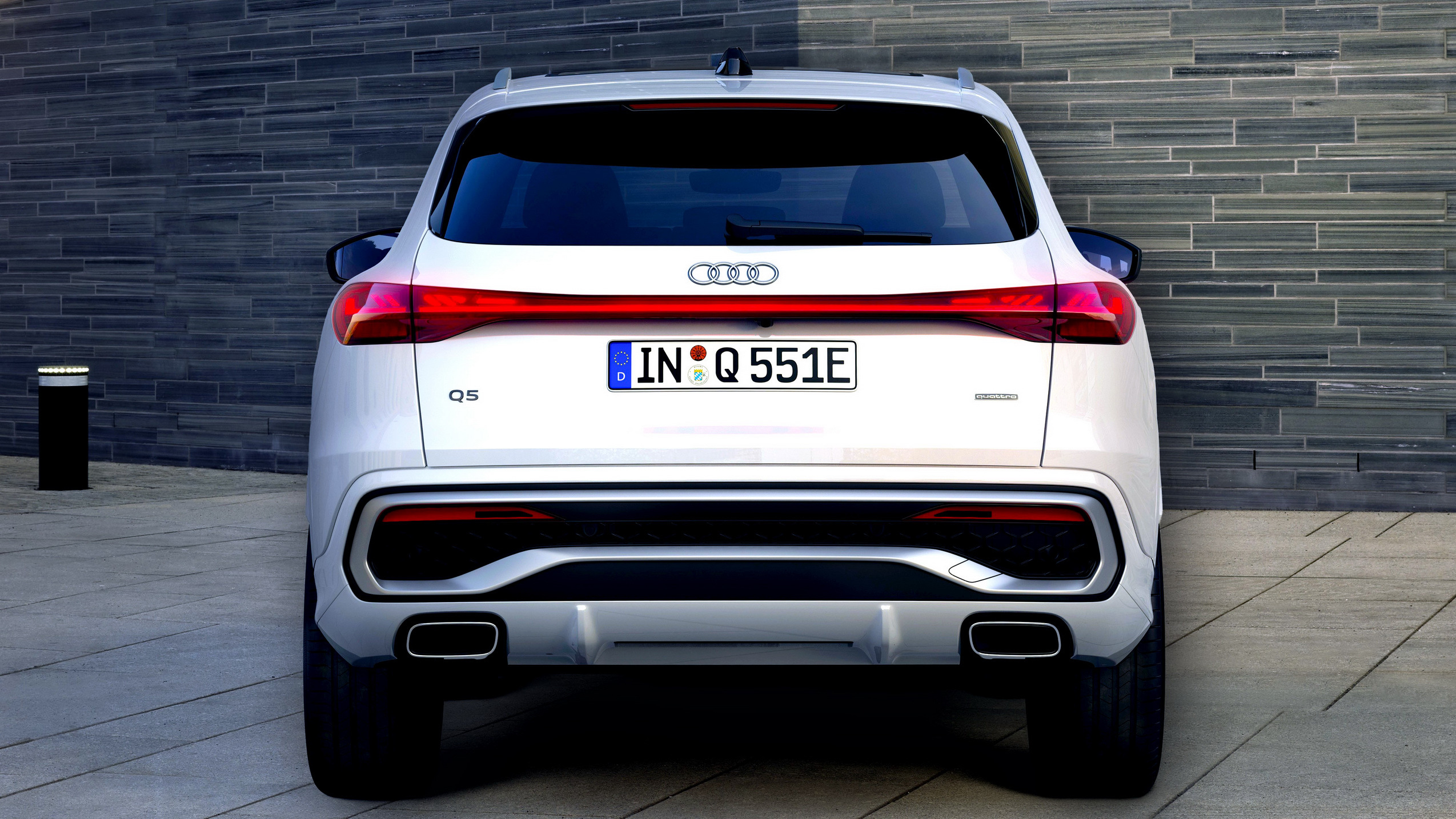 Audi Q5 rear view parked at home, second car on a multi-car insurance policy