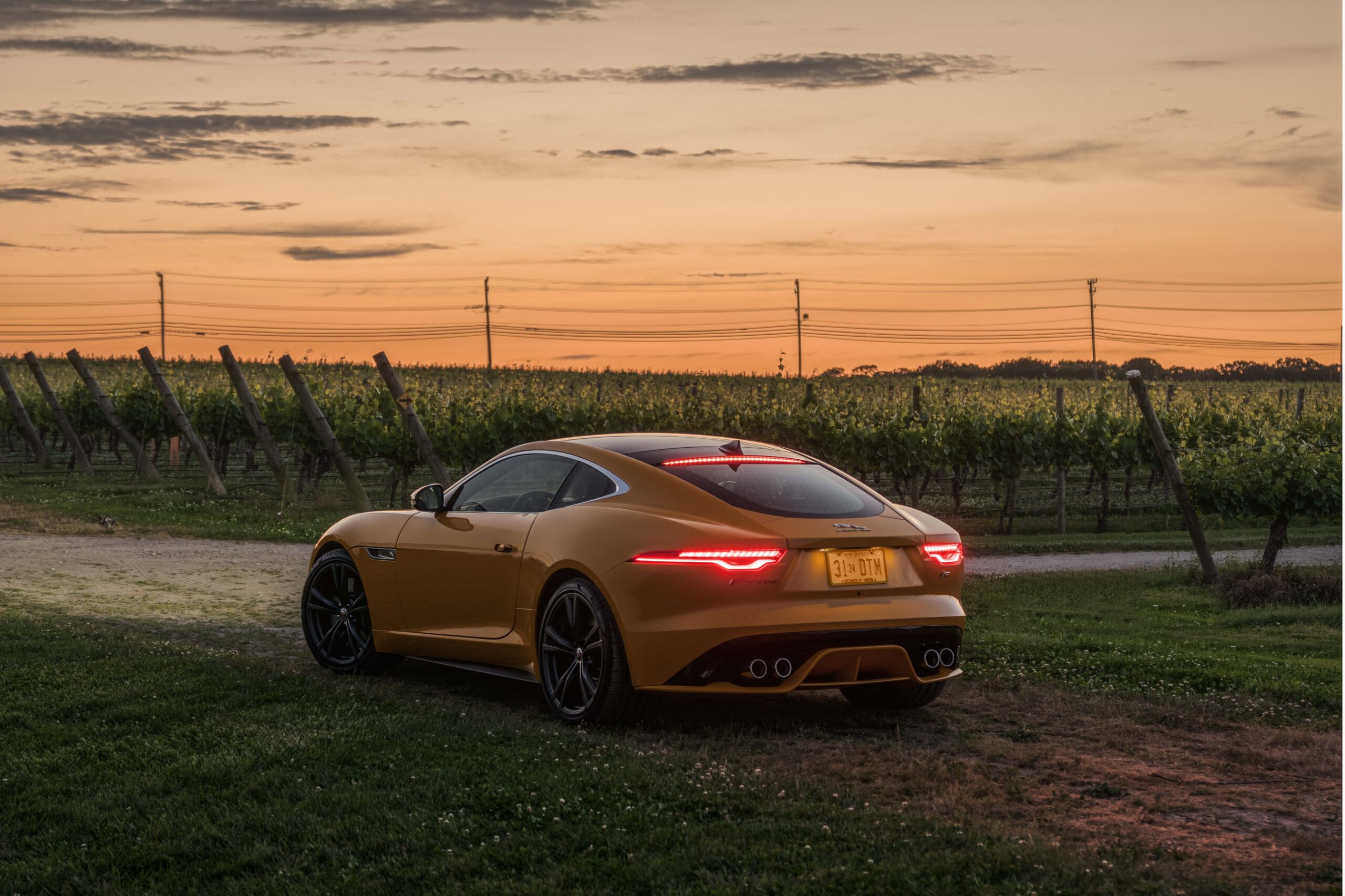 Jaguar F-Type rear three-quarter at sunset