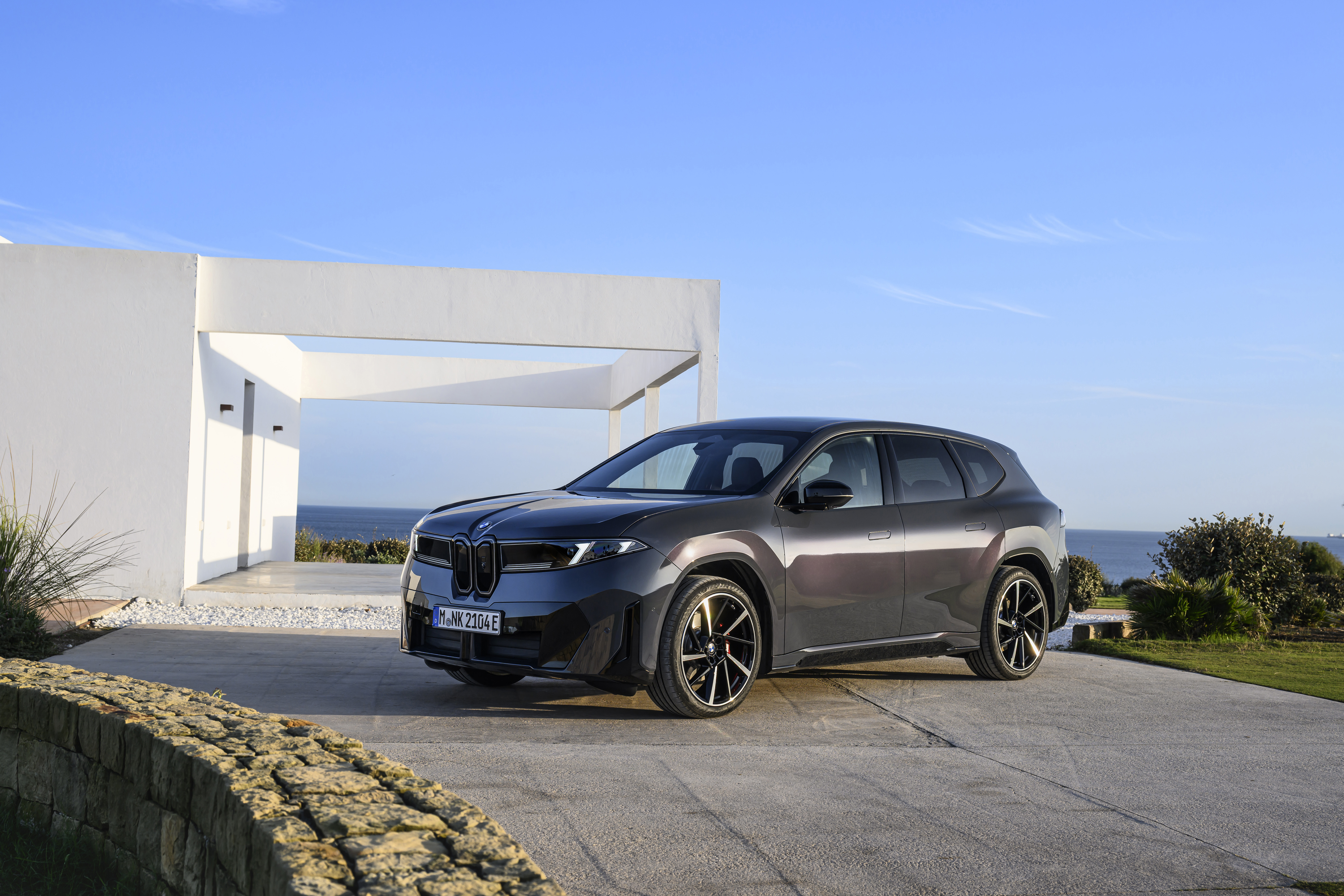 BMW iX3 Neue Klasse electric SUV exterior, side profile in dark finish