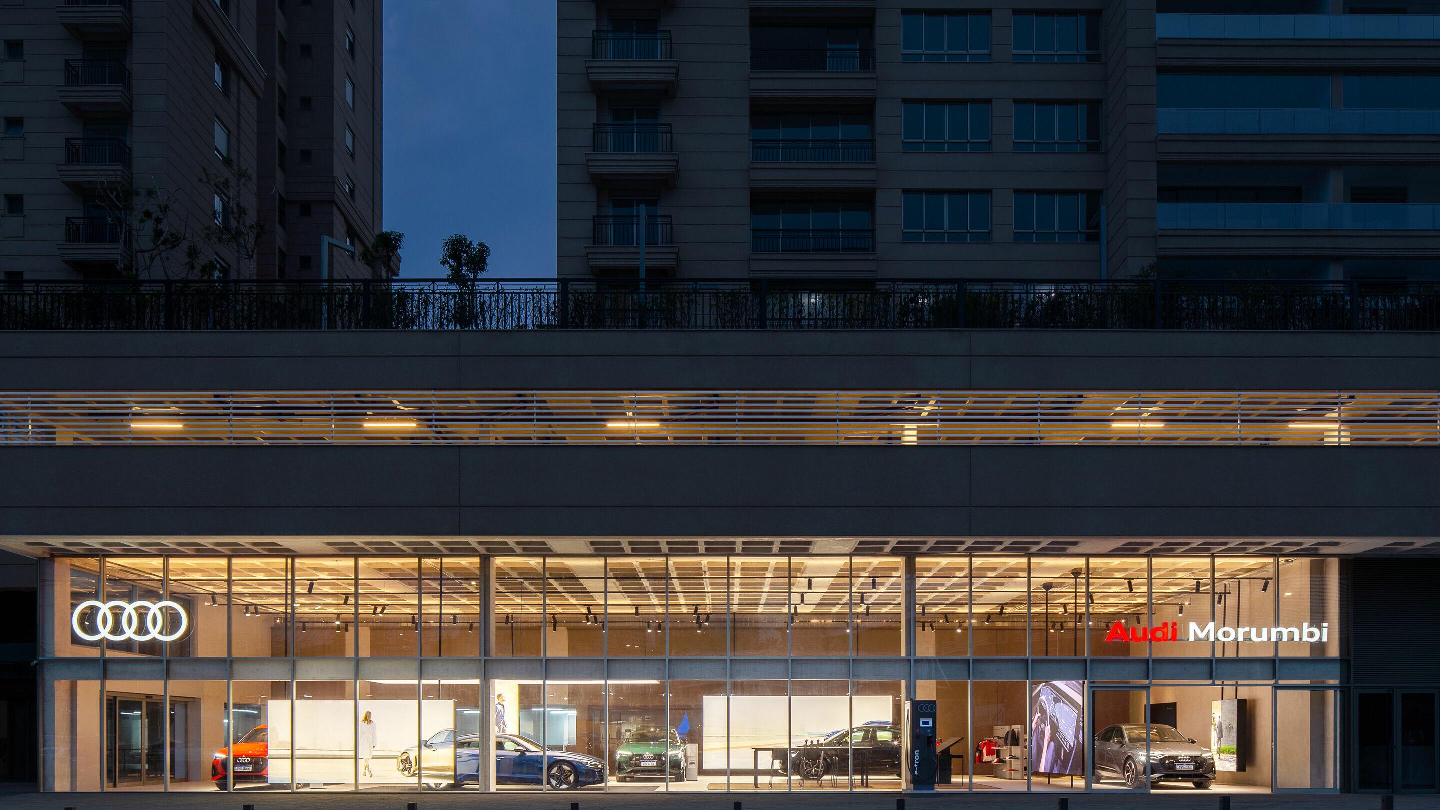 Audi dealership exterior at dusk, illustrative of UK premium car finance retail