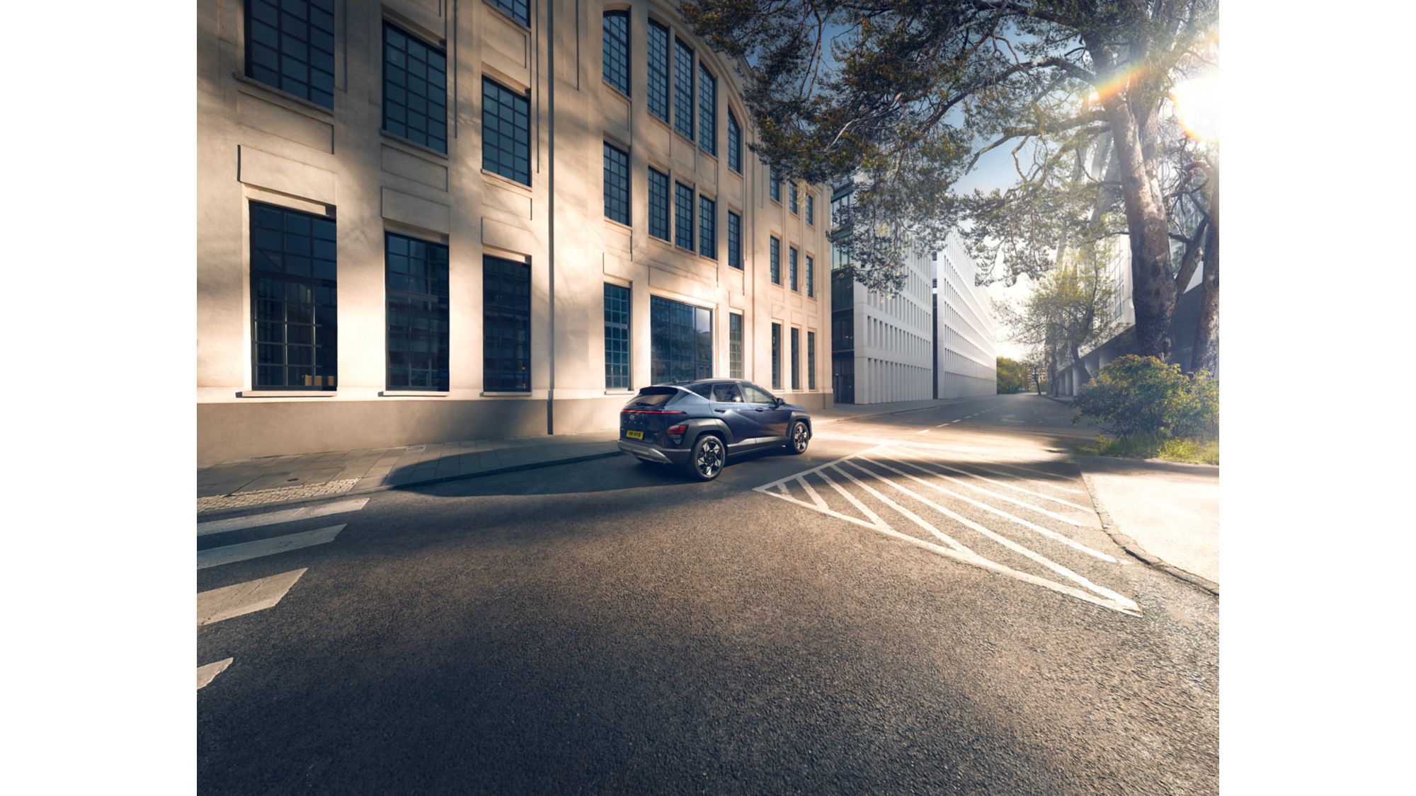 Hyundai Kona Hybrid rear three-quarter on an urban street, how PCP deals are built