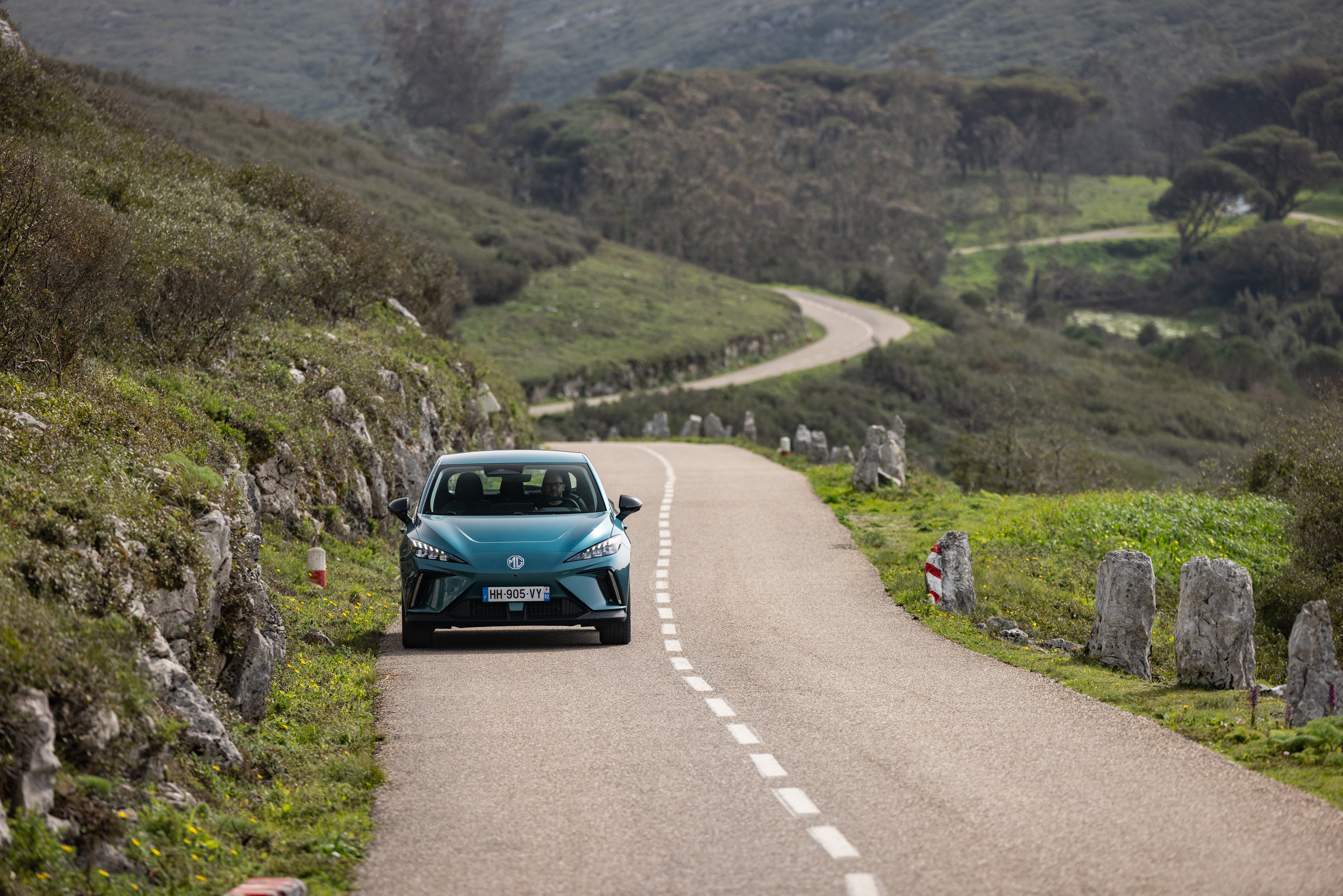 2026 MG4 EV on the Motability Scheme, front view driving on a winding road