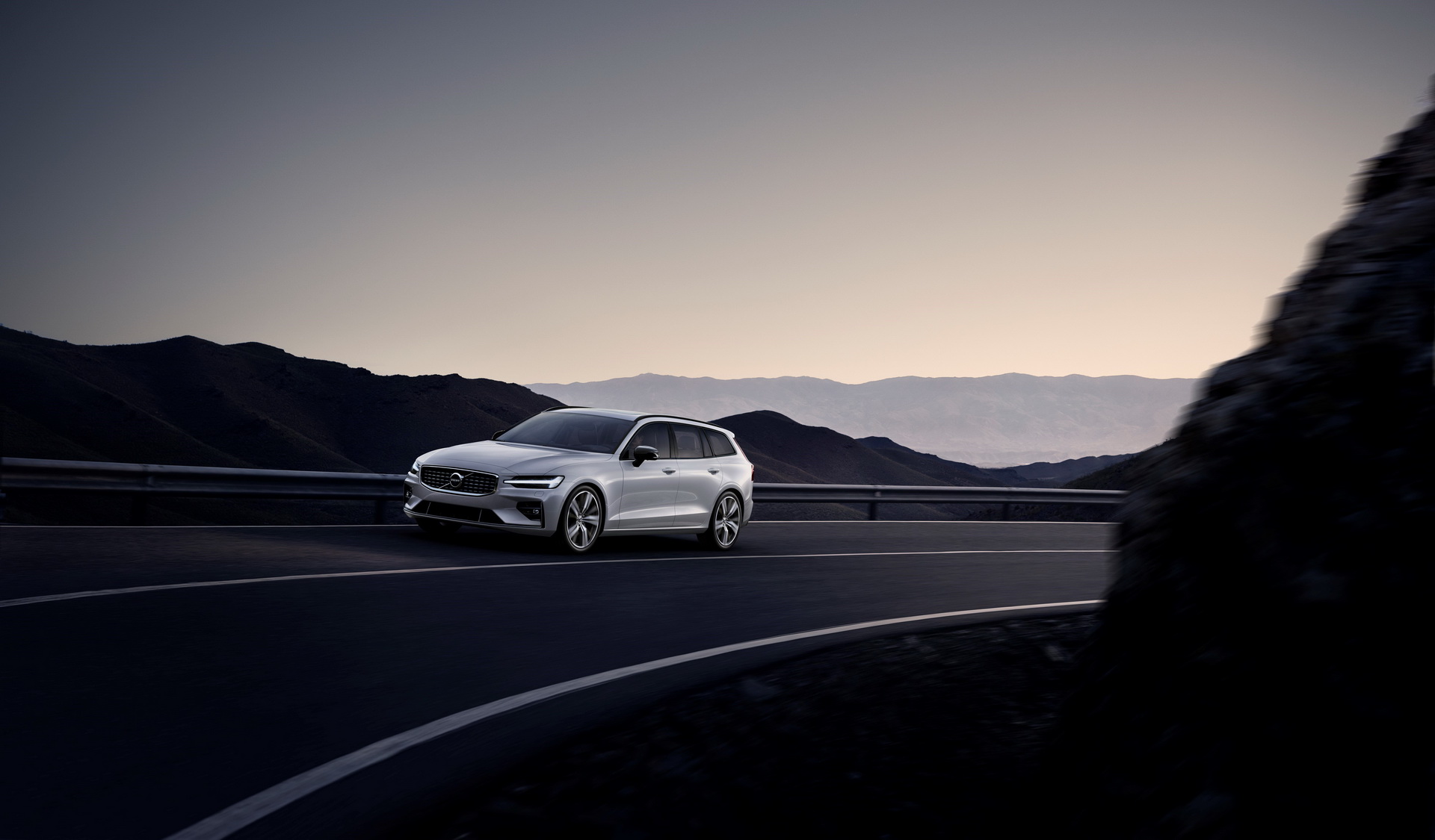 Volvo V60 used estate driving at dusk, the premium estate alternative to a 3-Series Touring or A4 Avant