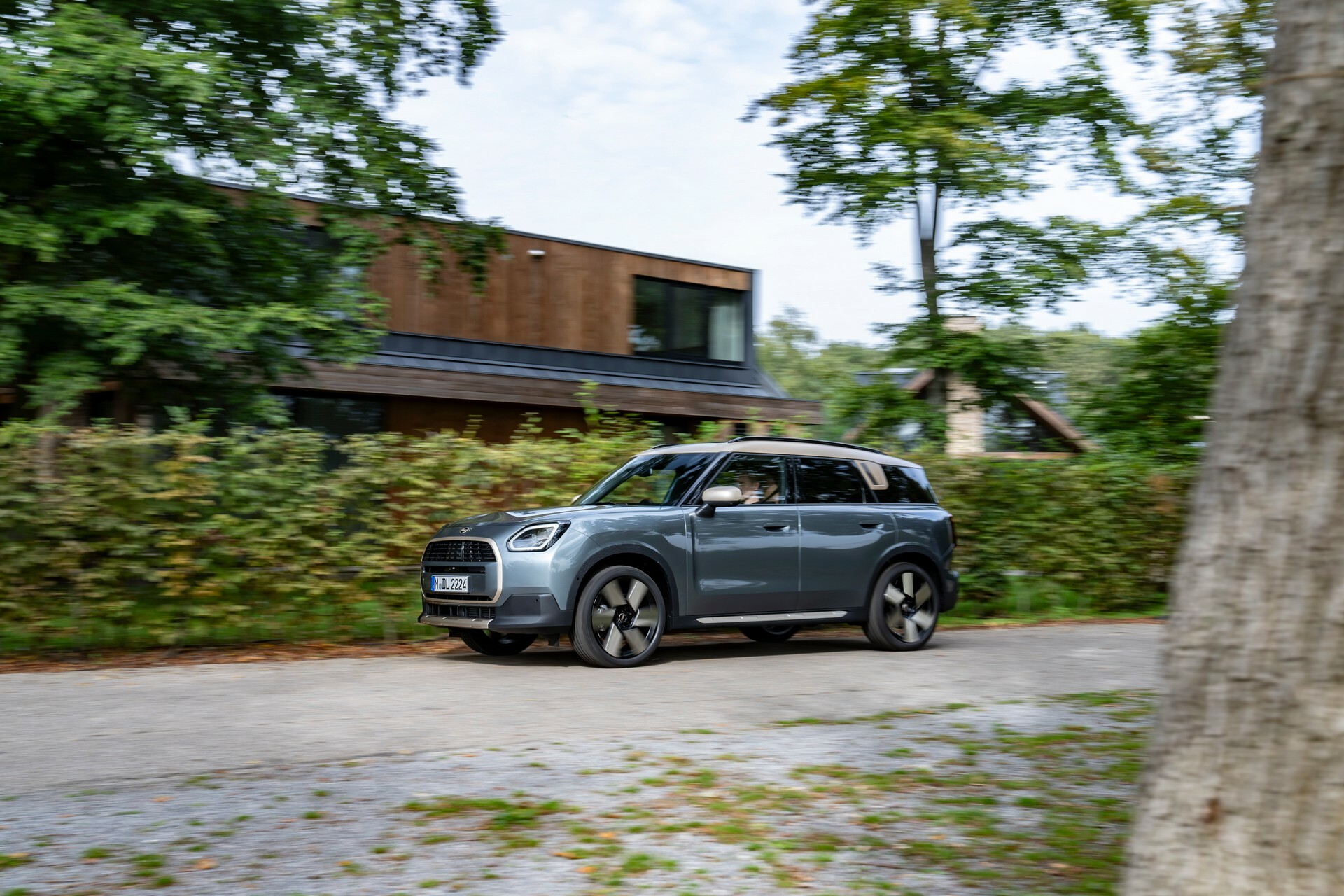Mini Countryman C driving on a country road, the petrol model behind our PCP worked example