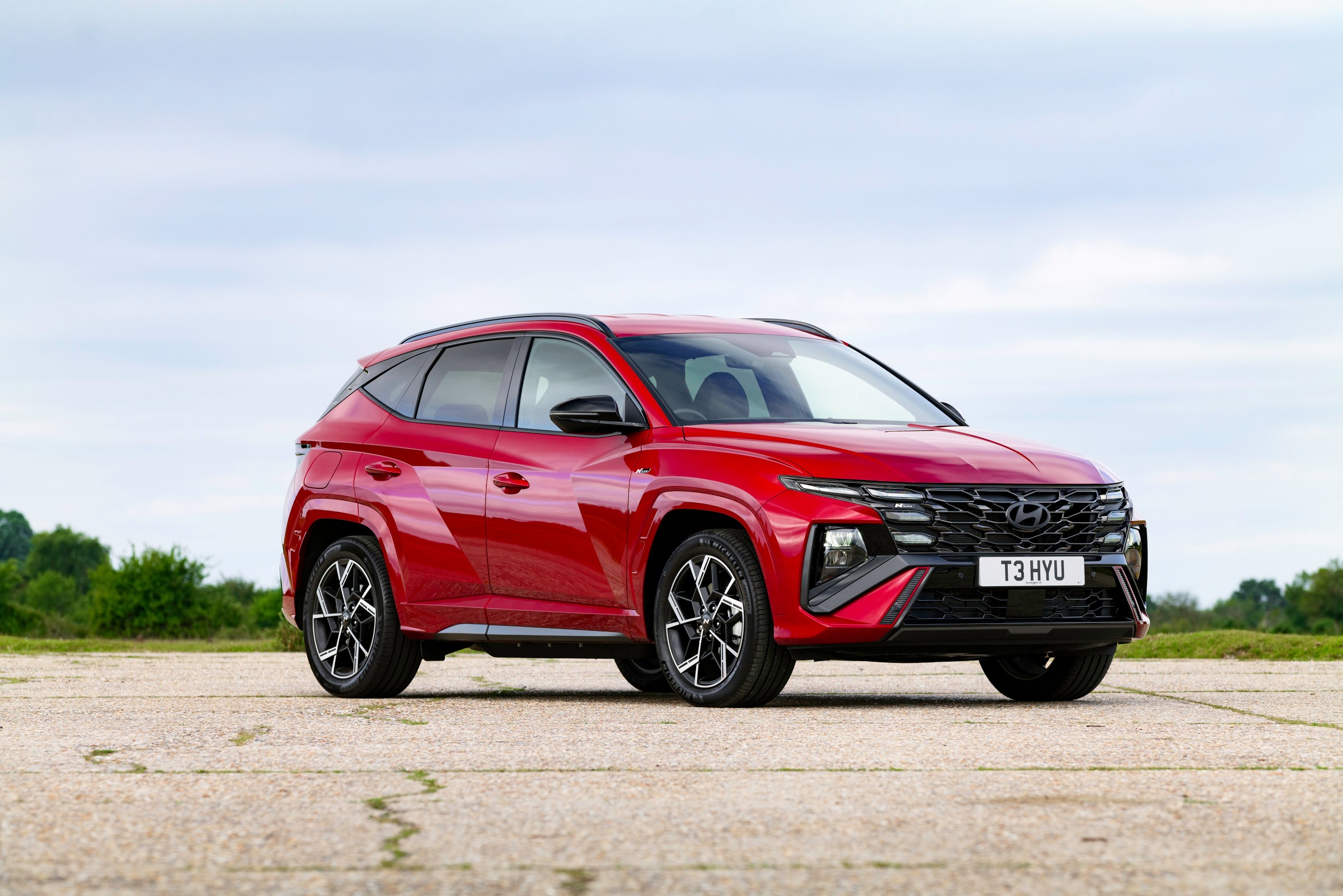 Hyundai Tucson Motability SUV N Line in red, front three-quarter