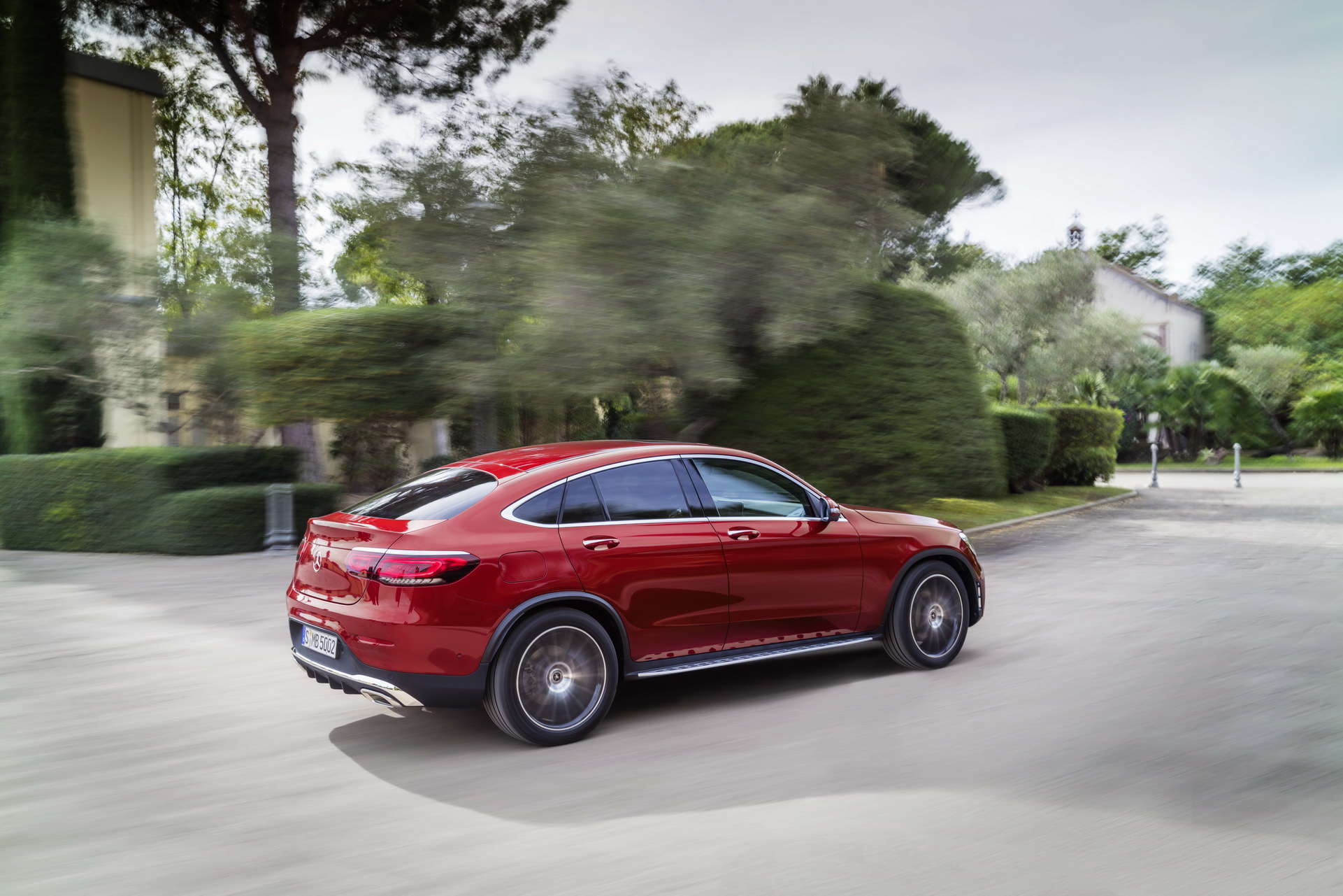 Mercedes GLC Coupe C253 rear three-quarter on the move in red
