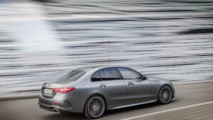 Mercedes C-Class W206 saloon rear three-quarter in motion