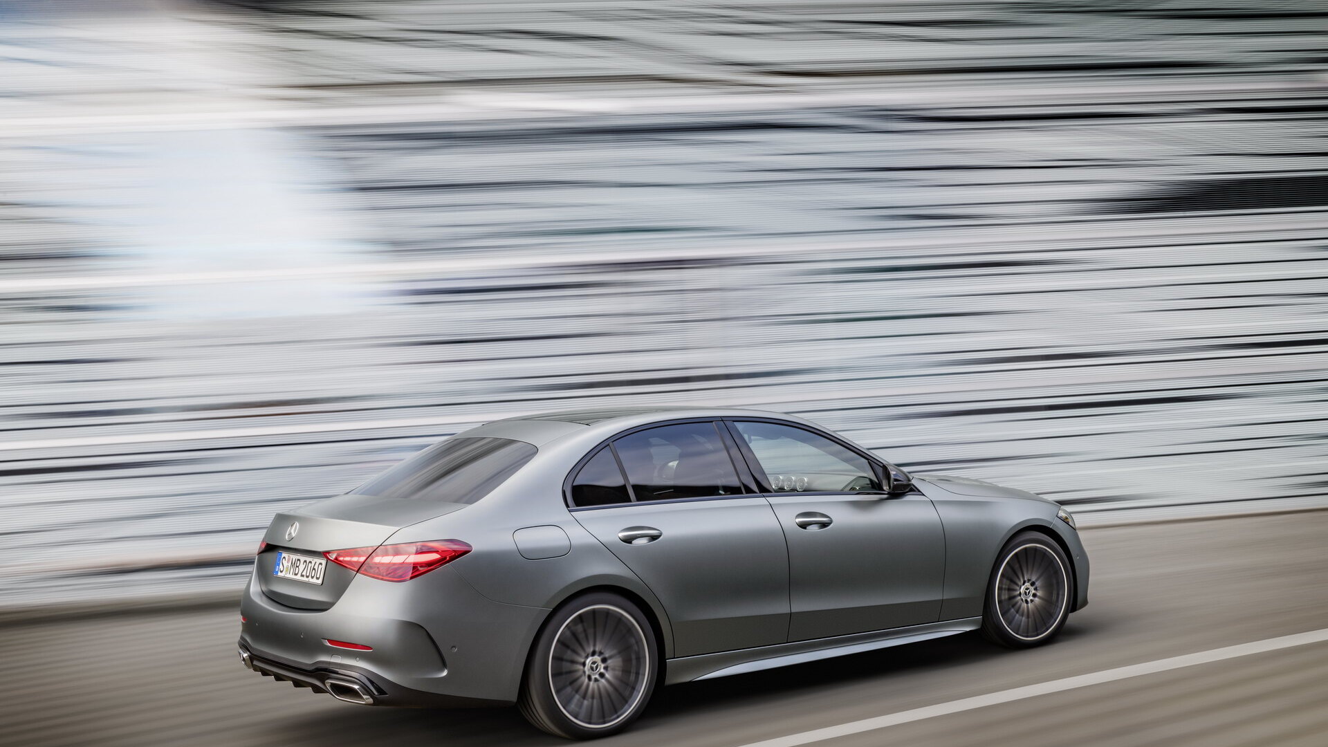 Mercedes C-Class W206 saloon rear three-quarter in motion