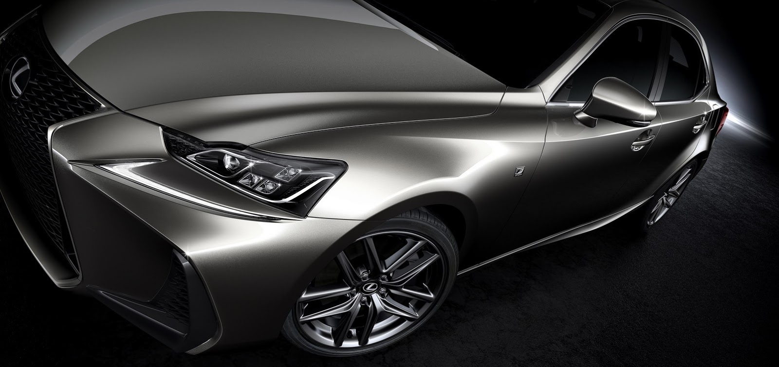 Lexus IS 300h front detail with LED headlight and alloy wheel