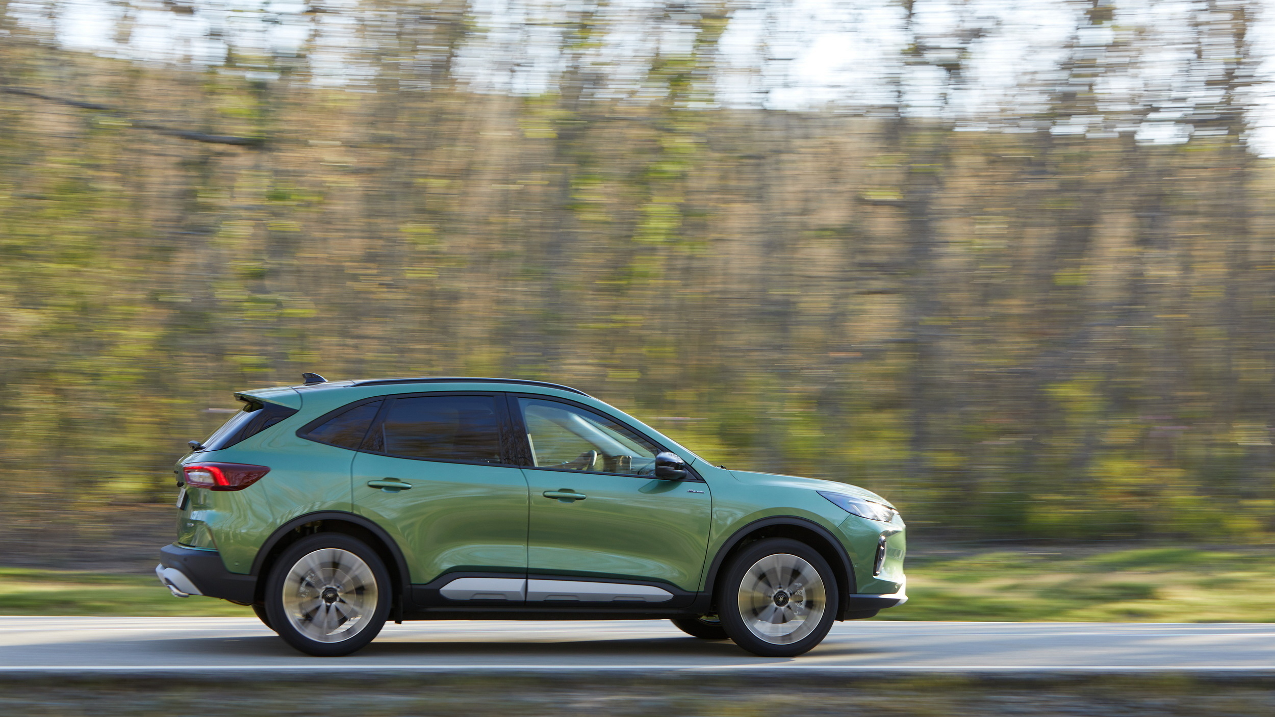 Ford Kuga PHEV on the move showing its side profile