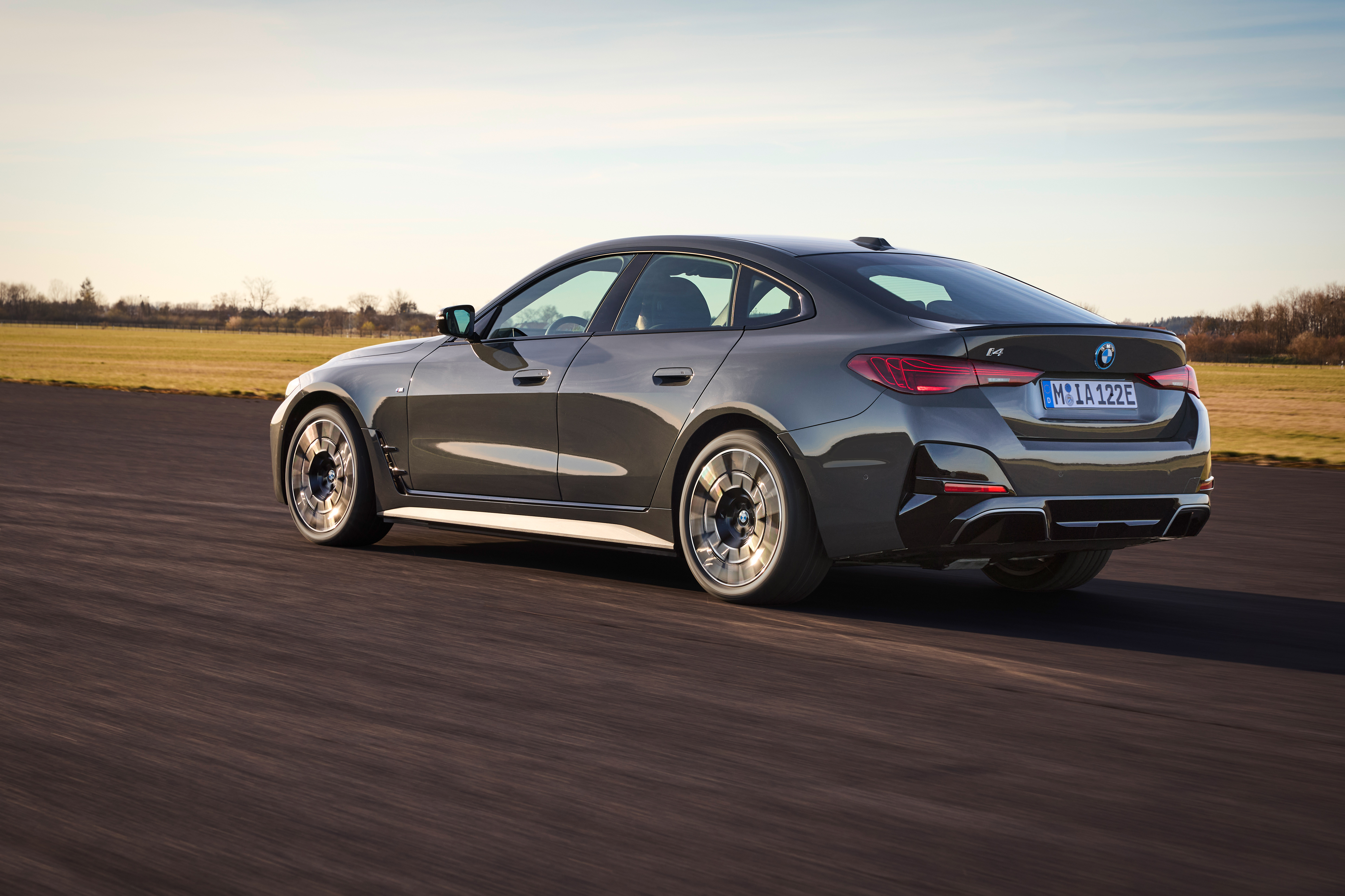 BMW i4 rear three-quarter view on a road