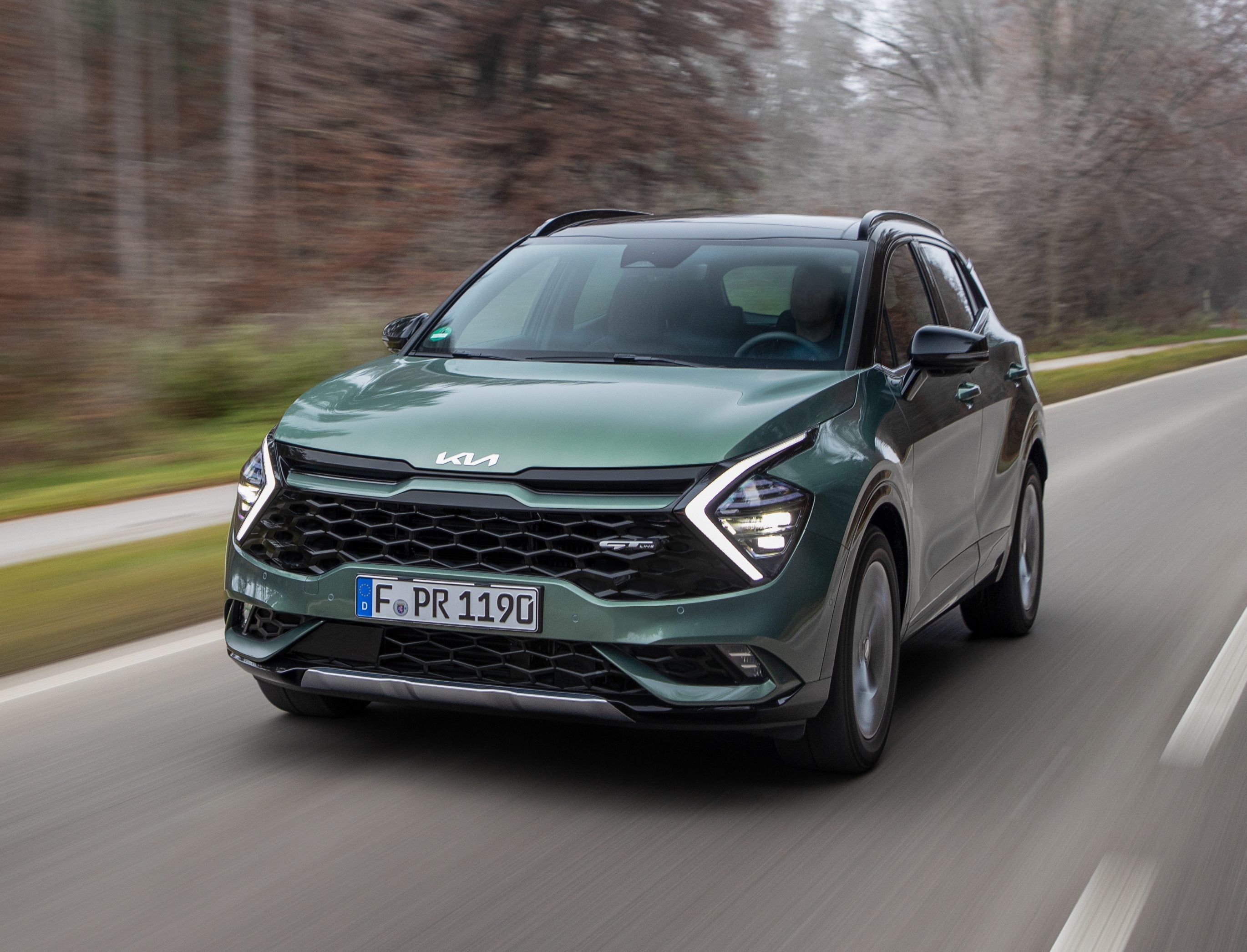 Kia Sportage Hybrid driving on a UK road