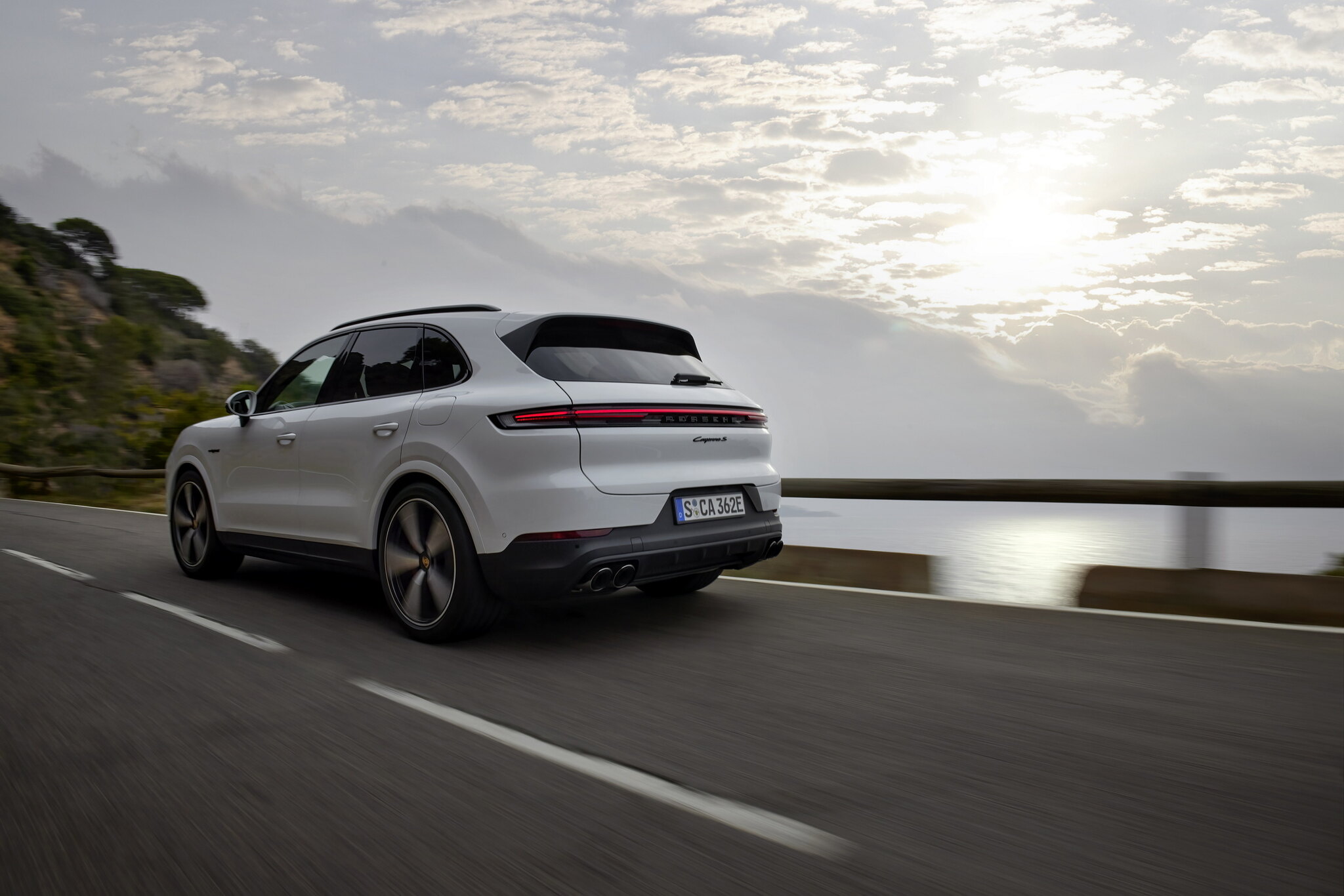 Porsche Cayenne E-Hybrid rear three-quarter at sunset