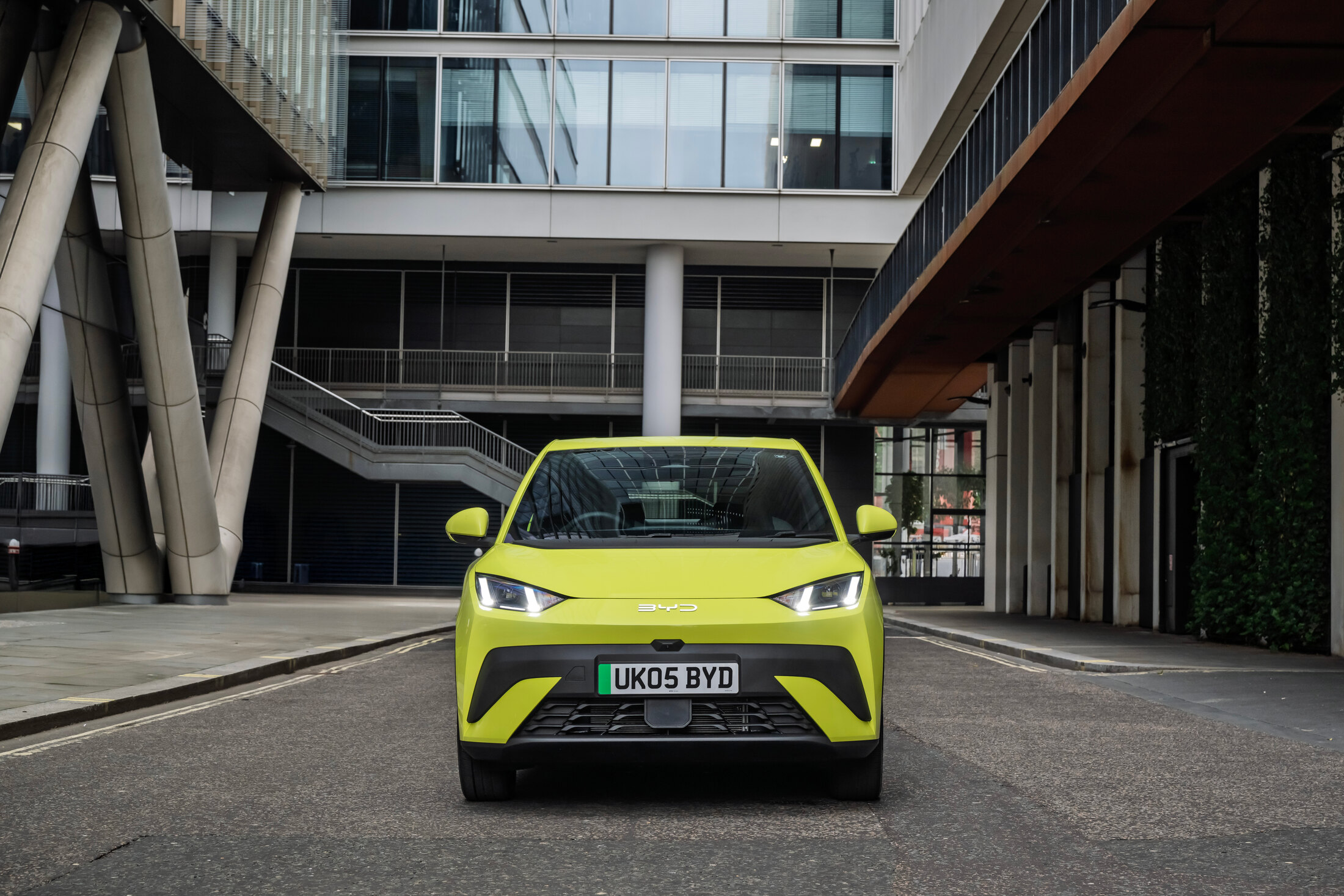 BYD Dolphin Surf in Lime Green, front view, parked on a London street