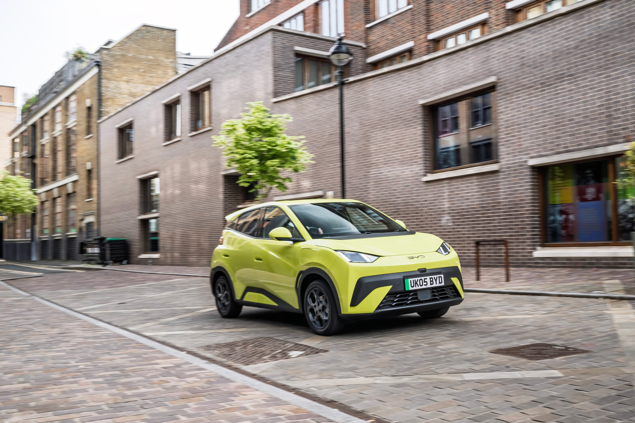 BYD Dolphin Surf driving on a cobbled London street