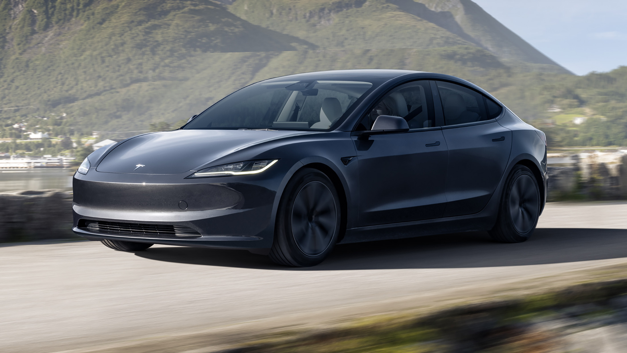 Tesla Model 3 front three-quarter, a common UK company-car EV under the ZEV mandate