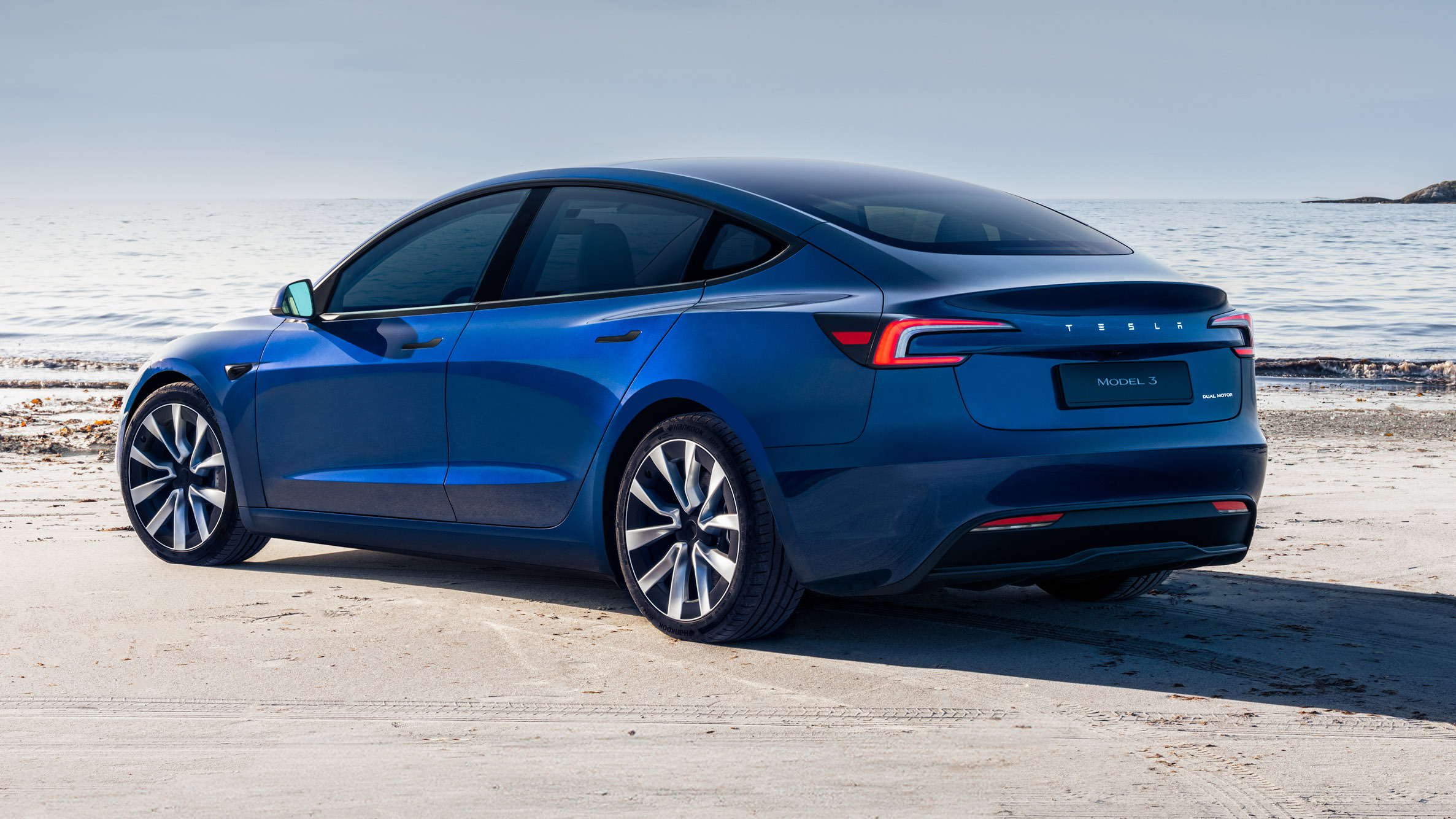 Tesla Model 3 rear three-quarter, an electric company car unaffected by ZEV mandate changes on benefit-in-kind