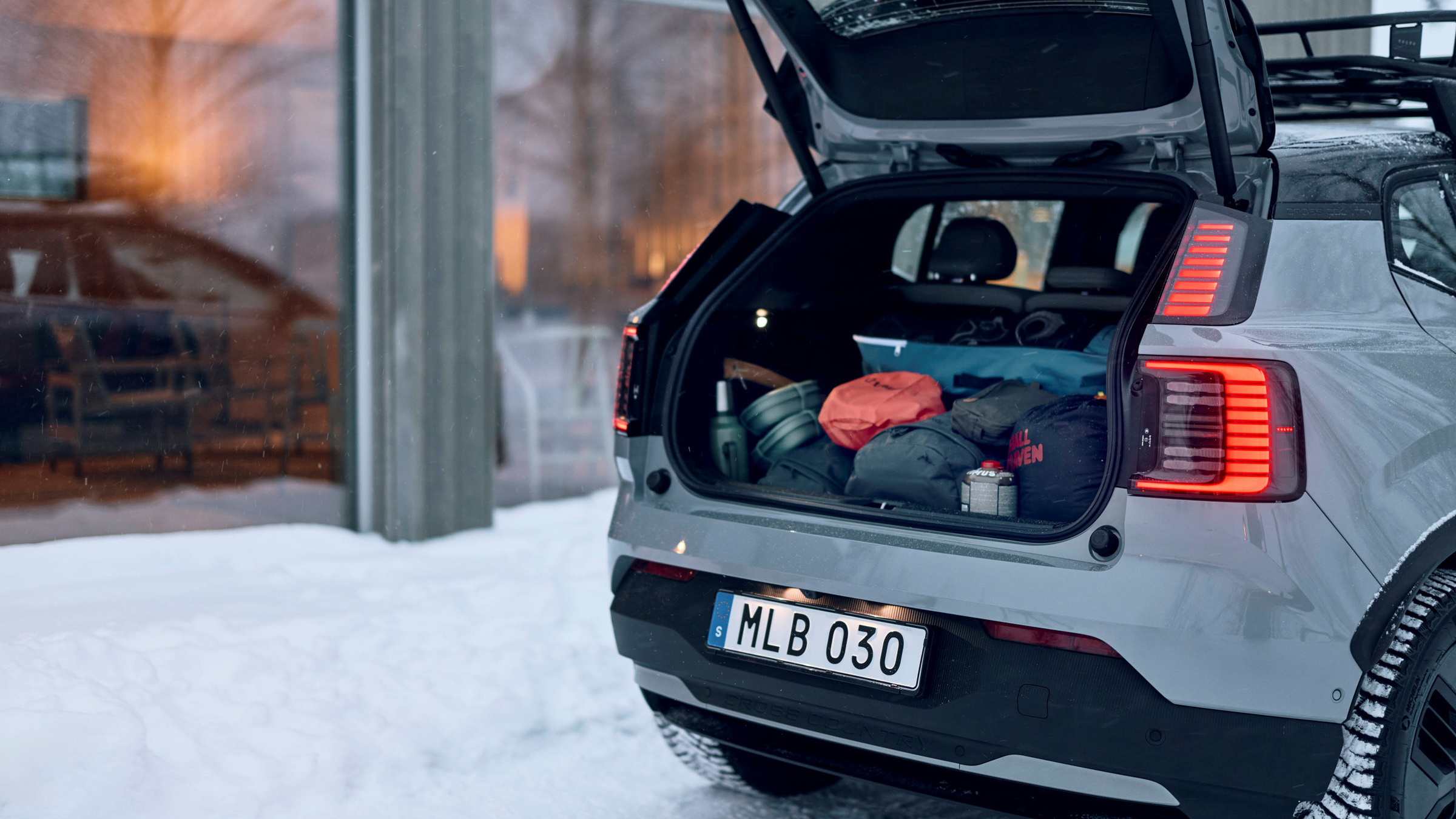 Volvo EX30 boot loaded with luggage in winter