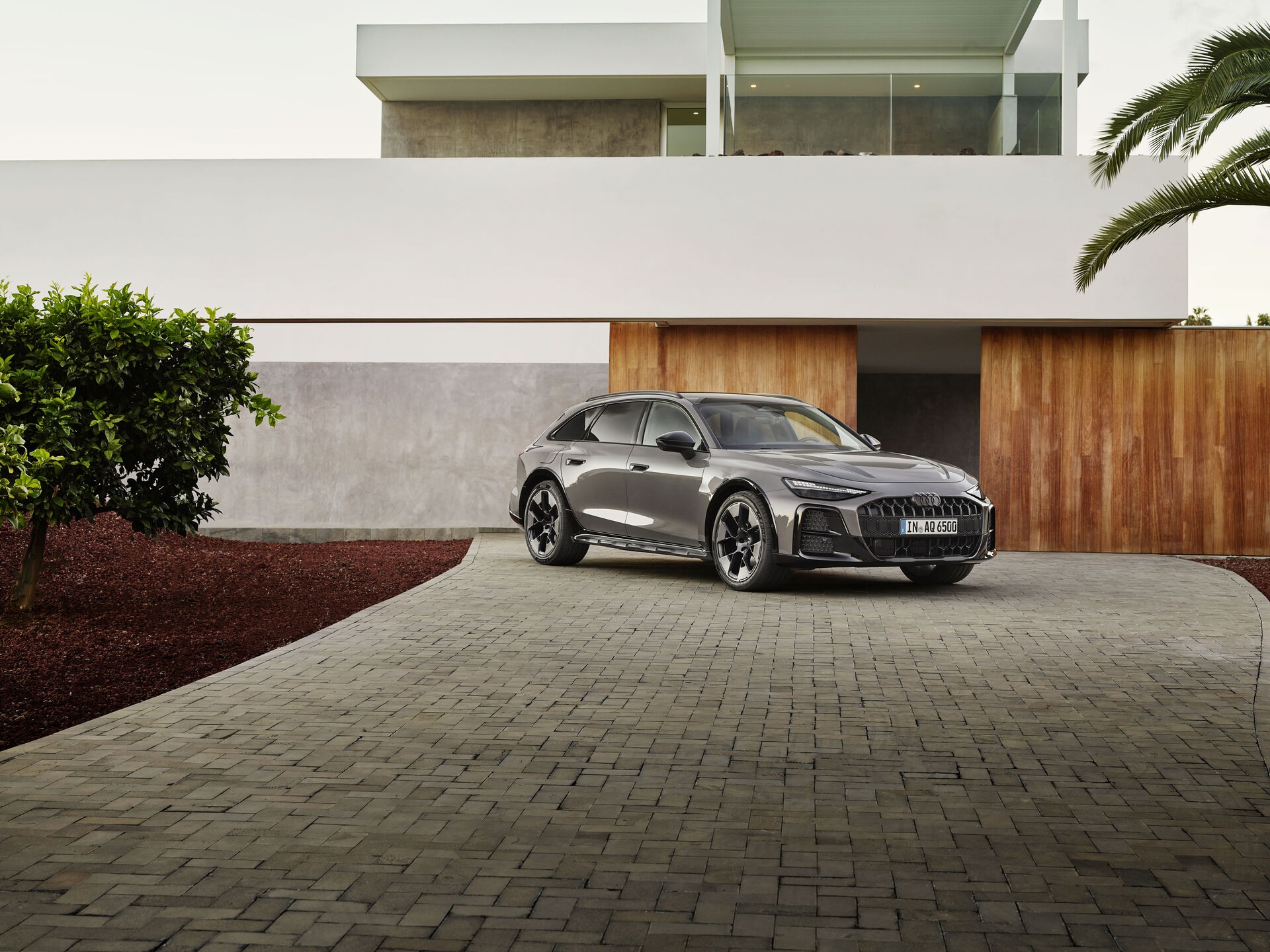 Audi A6 allroad parked outside a home